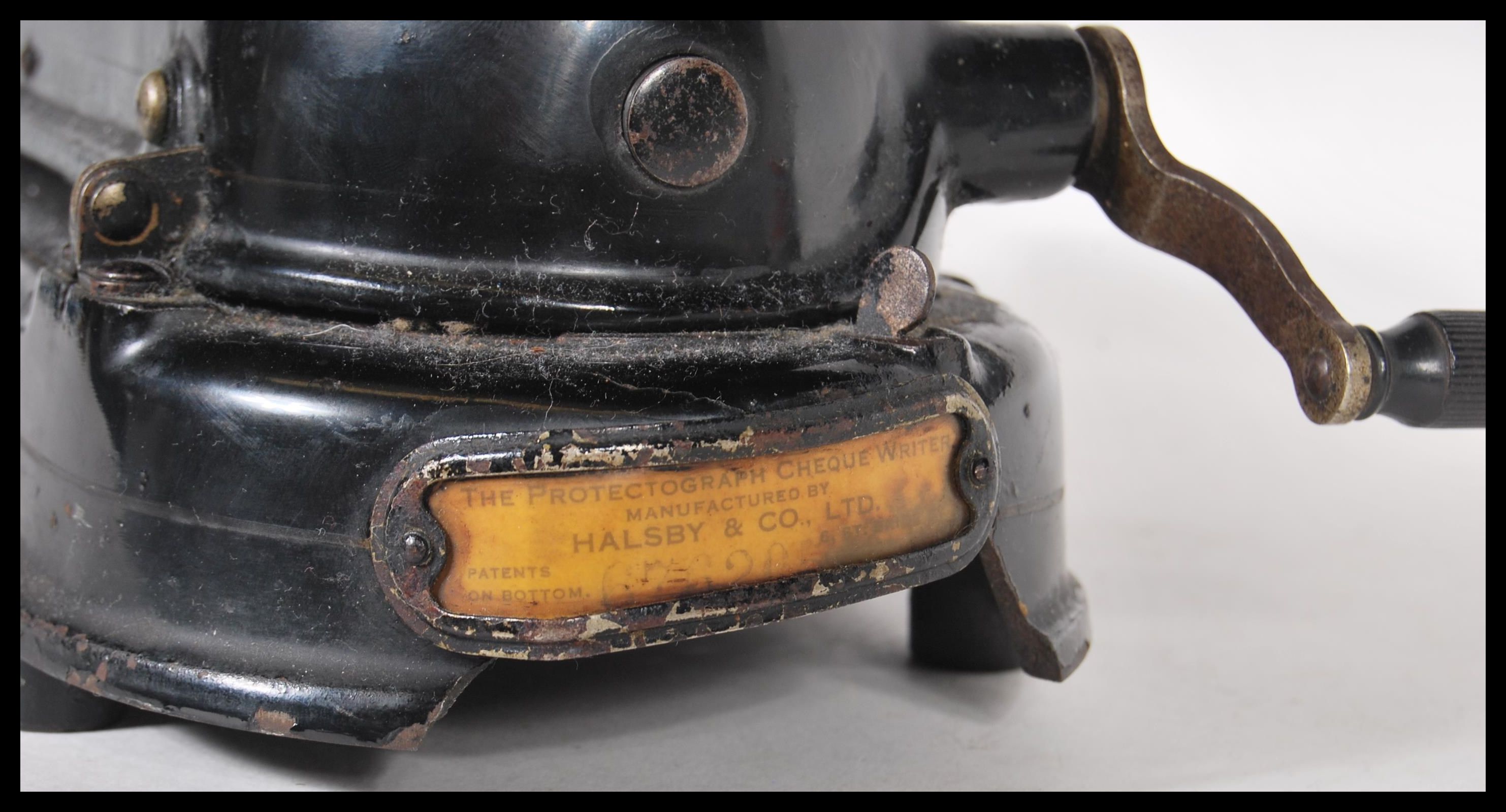 An early 20th Century vintage industrial Protectograph Cheque Writer machine having a black enamel - Image 4 of 5