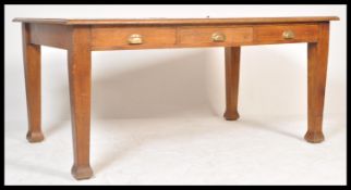 A large Edwardian Arts and Crafts solid oak library table / partners desk. Green leather gilt tooled