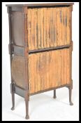 An early 20th Century Edwardian mahogany two tiered open bookcase, raised on block turned