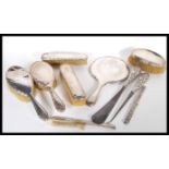 A collection of Victorian and later hallmarked silver ladies vanity dressing table items to