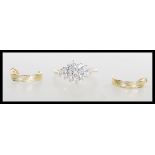 A hallmarked 9ct gold ladies cluster ring set with white brilliant cut stones to the head, (