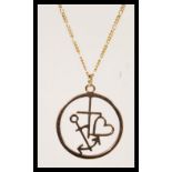 A 9ct gold ladies necklace pendant and chain being hallmarked to the pendant. The pendant with