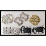 A selection of vintage Art Deco style belt buckles being set with white stones. 10 pieces in total.