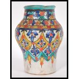 A vintage 20th Century ceramic / pottery Persian baluster vase decorated with fauna details in