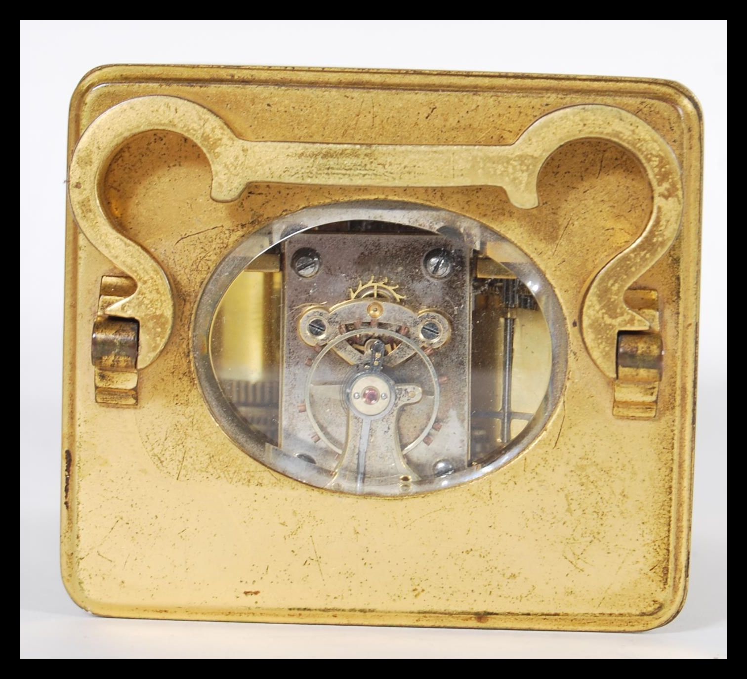 A 19th Century Victorian French gilt brass carriage clock having a white enamel face with Roman - Image 4 of 5