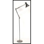 A retro 20th Century floor standing oversized anglepoise style standard lamp, raised on a circular