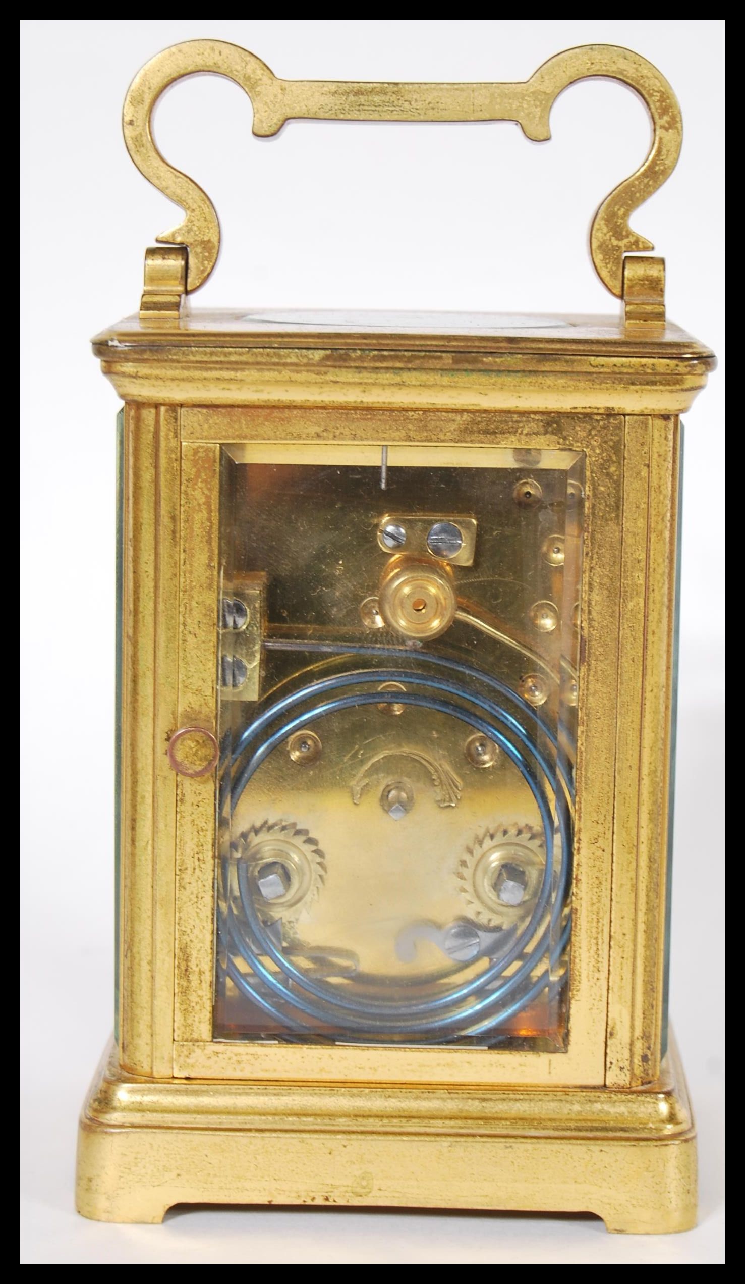 A 19th Century Victorian French gilt brass carriage clock having a white enamel face with Roman - Image 3 of 5