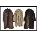 A selection of three vintage retro coats to include a brown sheepskin coat by Richard Draper, a grey