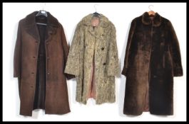 A selection of three vintage retro coats to include a brown sheepskin coat by Richard Draper, a grey