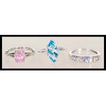 Three 9ct white gold rings to include a white gold ring set with a blue marquise cut stone stone (