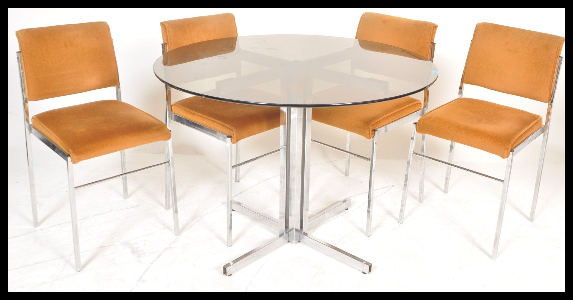 A vintage 20th Century retro chrome and glass dining table and chairs suite.The table raised on x - Bild 3 aus 5