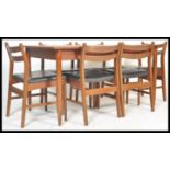 A vintage retro 20th Century teak Danish influence dining table suite with a set of six vintage teak