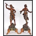 A pair of 20th Century bronzed cast metal figurines in the form of two Grecian style women, one