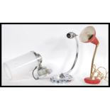 A group of three vintage retro 20th Century desk lamps / lights to include a chrome example, red