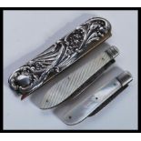 Two silver hallmarked folding mother of pearl fruit knives / pen knives. Both with Sheffield assay