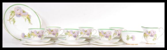 An early 20th Century Royal Doulton tea service in the Glamis Thistle H460 pattern consisting of