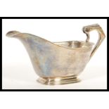 An early 20th Century hallmarked silver gravy sauce boat / milk creamer jug by Northern Goldsmiths