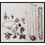 A group of sterling silver necklaces and pendants to include crucifix cross pendants, moonstone