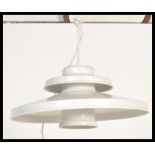 A vintage retro light fixture in the manner of Poul Henningsen having a two step UFO type shape in a