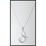 A stamped 925 silver necklace having a silver pendant set with a large moonstone cabochon. Weight