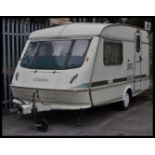 A 20th Century circa mid 1990's Elddis two berth touring caravan, the caravan in good condition