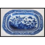 A 19th Century Chinese ceramic tray having hand painted blue and white decoration depicting a