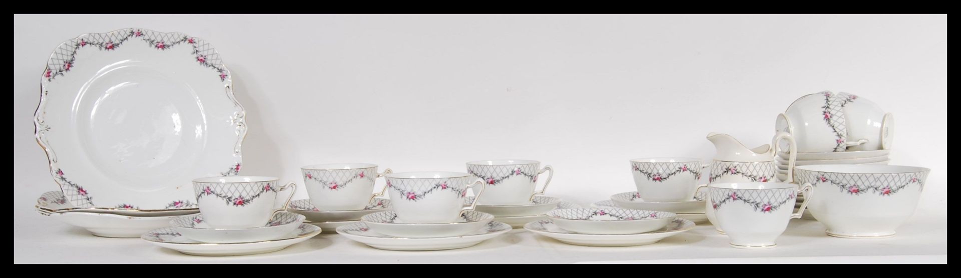 A 20th Century Paragon fine English bone china tea service in the Rose Garden pattern consisting