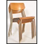 A set of four vintage mid 20th century church / village hall stacking chairs. With tubular frames