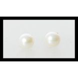 A pair of fresh water pearl earrings having 9ct gold posts. Weight 0.9g. Stamped 375.