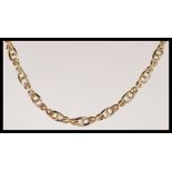 A hallmarked 9ct gold Italian curb link necklace chain having a lobster claw clasp. Weighs 18.6