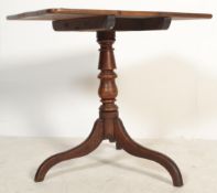 A 19th Century mahogany square tilt-top occasional / wine table raised on turned column raised on