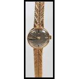 A vintage boxed Omega 9ct gold ladies watch set to a 9ct gold herringbone watch bracelet strap.