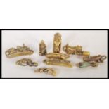 A collection of 20th Century erotic fertility pendants in the form of a selection of animals on