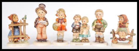 A group of six vintage 20th Century West German Goebbels ceramic figurines to include Trumpet Boy