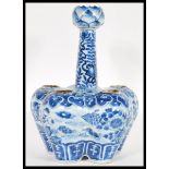 A 19th Century Chinese blue and white hand painted tulip vase the lobbed body detailed with five