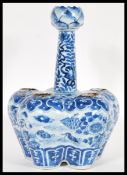 A 19th Century Chinese blue and white hand painted tulip vase the lobbed body detailed with five