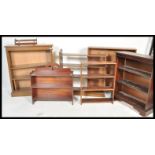 A collection of open bookcases to include an early 20th Century Edwardian oak example with column