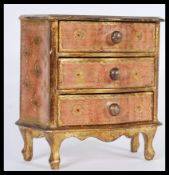 A 20th Century Antique Louis XVI style wooden apprentice piece chest of drawers having gesso gilt