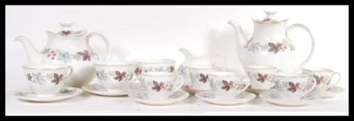 A 20th Century Royal Doulton tea service in the Camelot pattern consisting of two large cake plates,