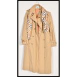 A Vintage 20th Century ladies Aquascutum  belted raincoat trench mac together with a 20th Century