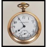 A gold plated 20th Century Special pocket watch having an open face with a white enamelled dial with