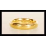 A hallmarked 22ct gold band ring. Hallmarked Birmingham 1924. Weight 6.2g. Size L.5.