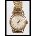 A Roamer premier 17 jewels super shock gentleman's wrist watch, having a round face with gilt arabic