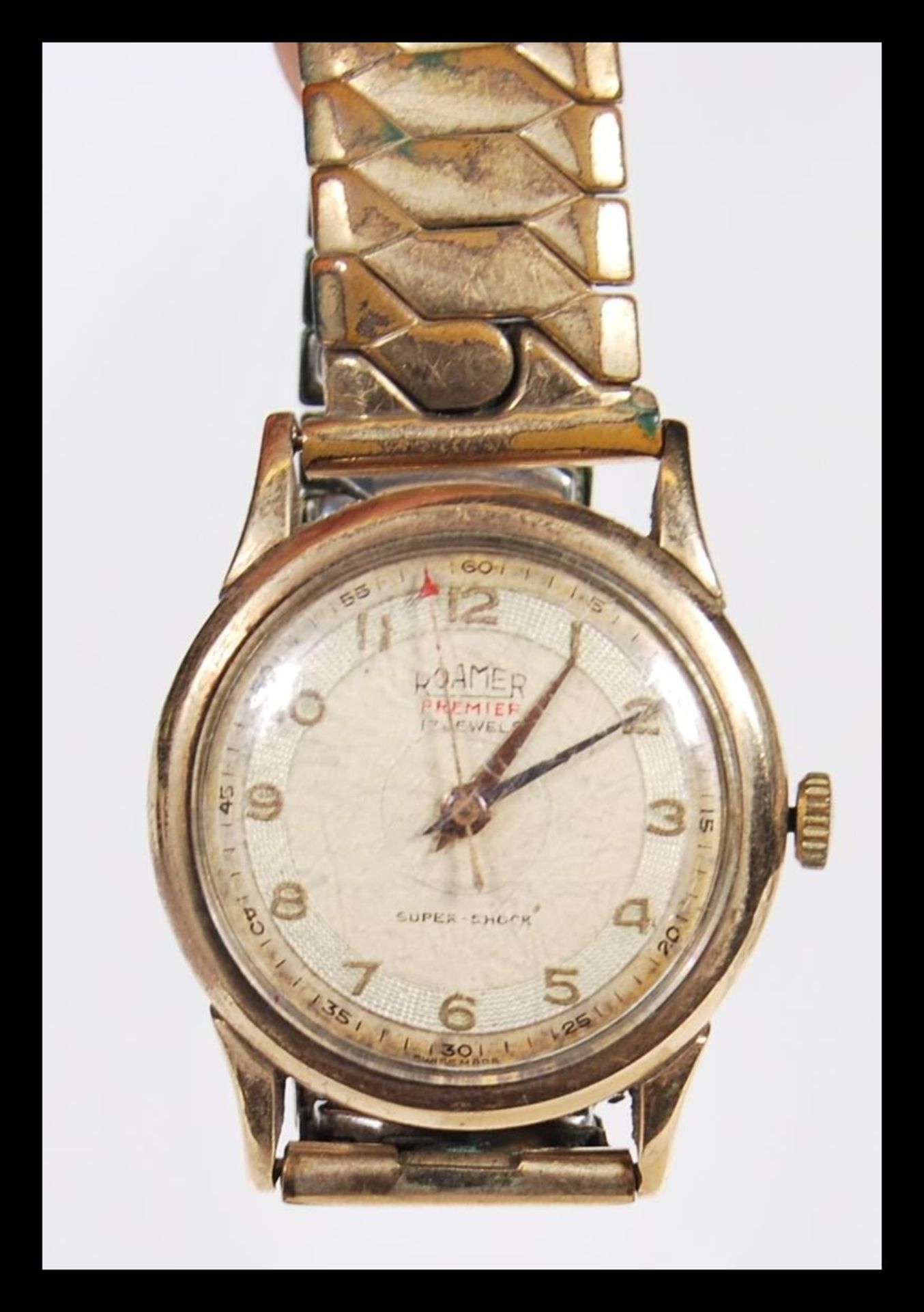 A Roamer premier 17 jewels super shock gentleman's wrist watch, having a round face with gilt arabic