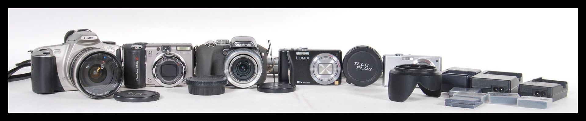 A collection of digital cameras to include an Olympus, Lumix cameras, accessories, Canon