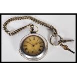 An early 20th Century silver white metal pocket watch having a white enamelled dial with roman