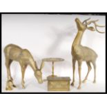 A collection of 20th Century brass wears to include a pair of deer figures including a stag and a
