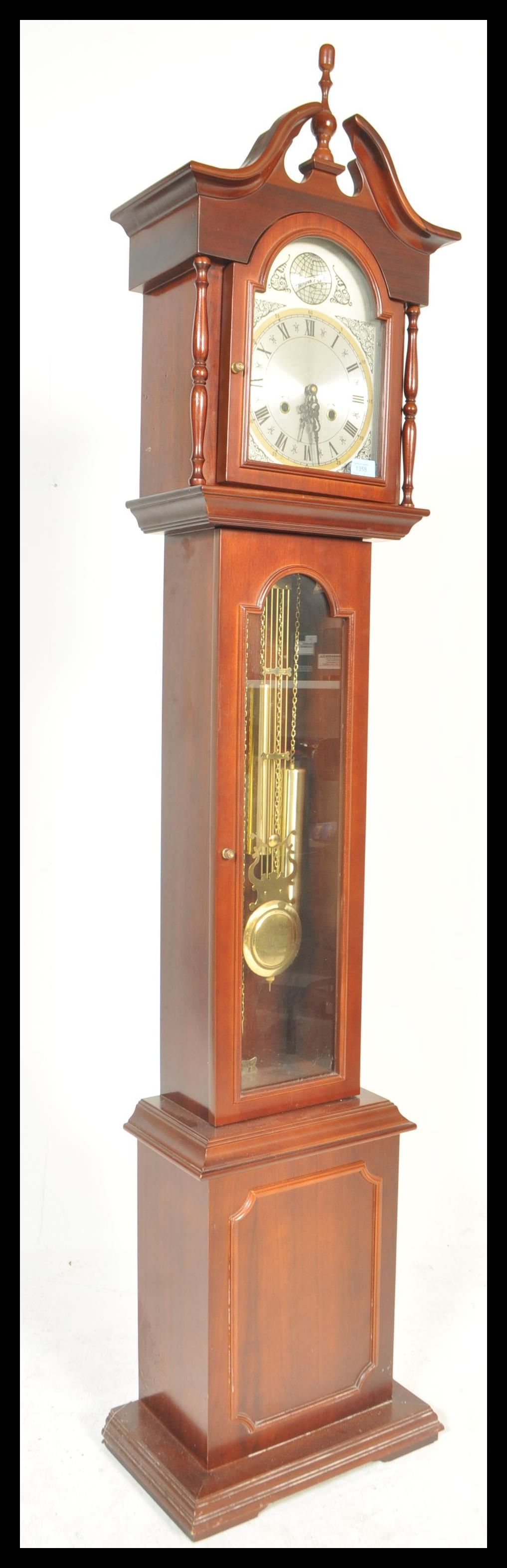 A contemporary 20th Century reproduction mahogany long case clock, stepped arch hood, gilt dial with