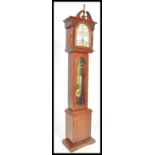 A contemporary 20th Century reproduction mahogany long case clock, stepped arch hood, gilt dial with