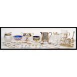 A collection of silver plated items dating from the 19th Century to include a toast rack, preserve